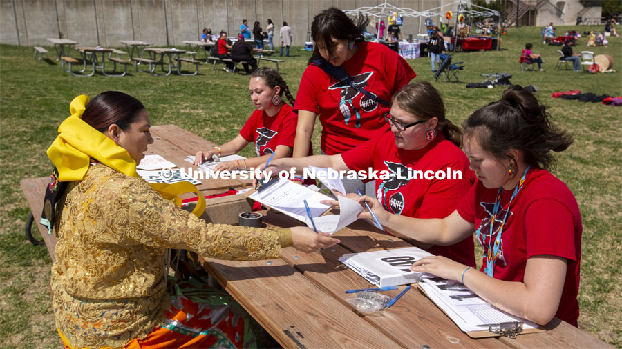 UNITE members register Kaira Wolfe, who served as the head woman dancer during the powwow. 2022 UNITE powwow to honor graduates (K through college). Held April 23 on the greenspace along 17th Street, immediately west of the Willa Cather Dining Center. This was UNITE’s first powwow in three years. The MC was Craig Cleveland Jr. Arena director was Mike Wolfe Sr. Host Northern Drum was Standing Horse. Host Southern Drum was Omaha White Tail. Head Woman Dancer was Kaira Wolfe. Head Man Dancer was Scott Aldrich. Special contest was a Potato Dance. April 23, 2023. Photo by Troy Fedderson / University Communication.
